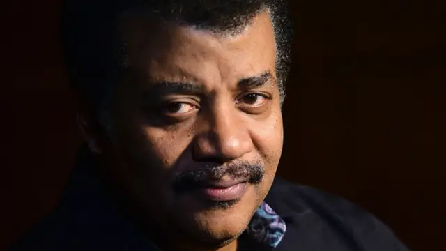 Neil deGrasse Tyson portrait beside an unknown IQ evidence label and stars