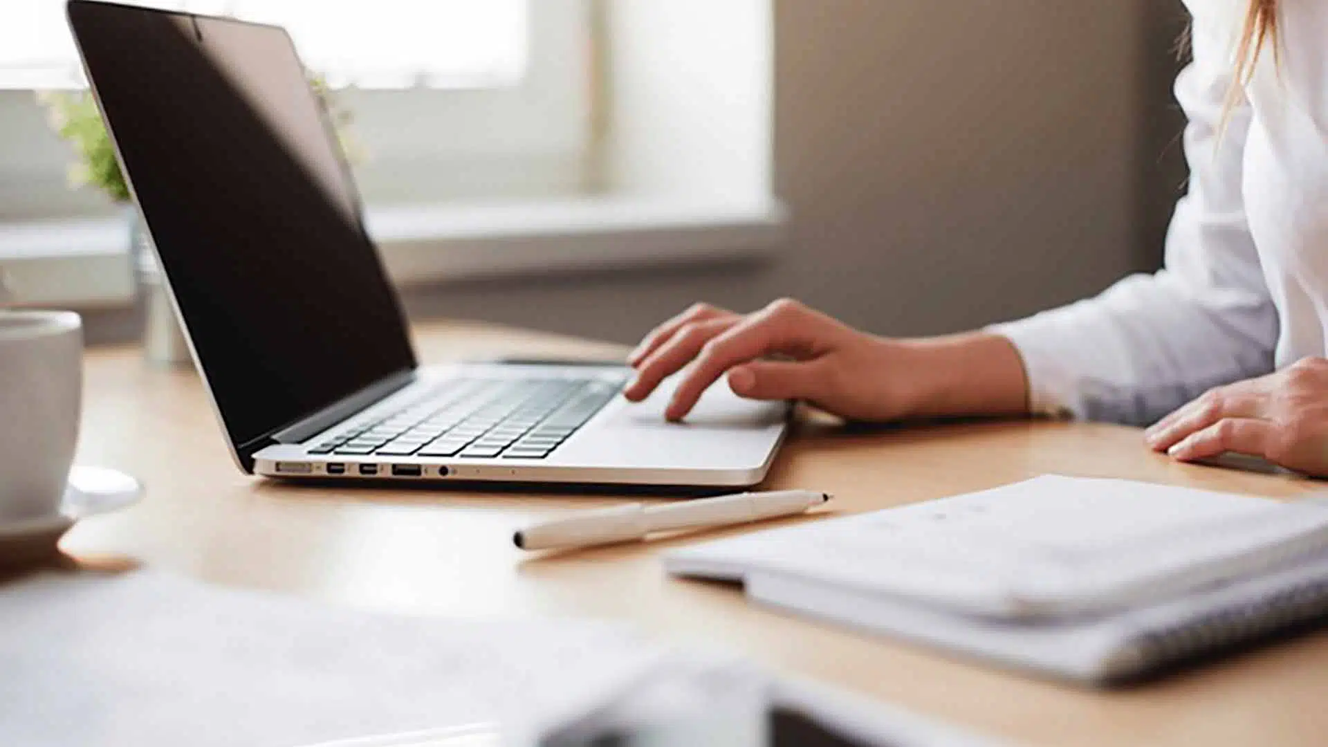 Person taking an online IQ test on a laptop at a desk