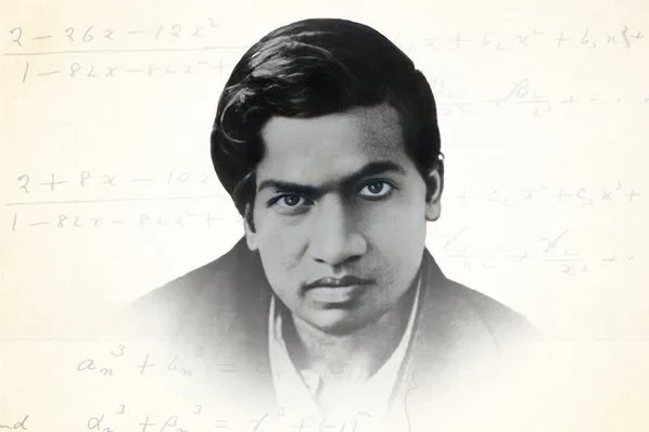 Black and white photograph of a young man with dark hair and a dark jacket, looking straight at the viewer, fading into a pale background of handwritten mathematical formulas.