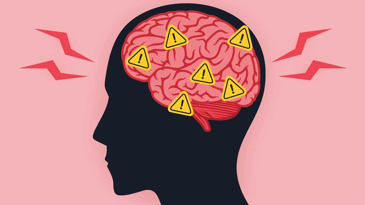 A dark navy silhouette of a head in profile facing left, filled with a pink and red brain marked with seven yellow warning triangles, each holding an exclamation mark, on a pink background with red lightning bolt shapes on both sides.