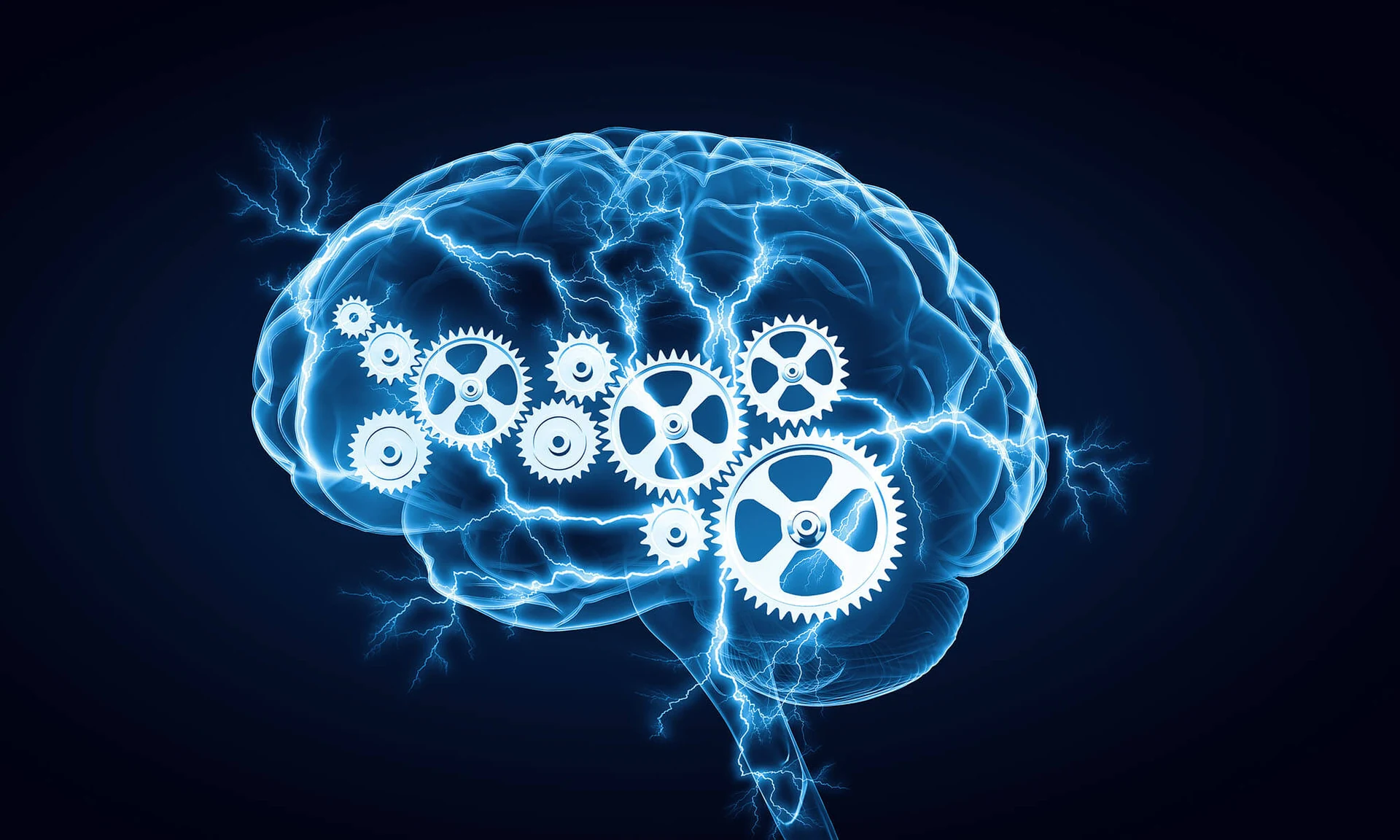 A translucent blue human brain seen from the side against a dark navy background, with a cluster of white interlocking gears inside it and thin branching lightning bolts running across and around it.